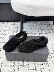 ALAIA 26S FLAT SLIP-ONS IN BLACK SUEDE WITH OPENWORK PATTERN