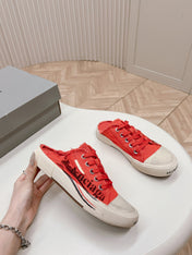 SNEAKER MULES IN RED CANVAS GRAFFITI LOGO