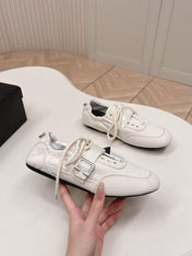 PRADA 26S LACE UP MINIMAL SNEAKERS IN WHITE CANVAS