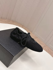 PRADA 26S LACE UP MINIMAL SNEAKERS IN BLACK CANVAS