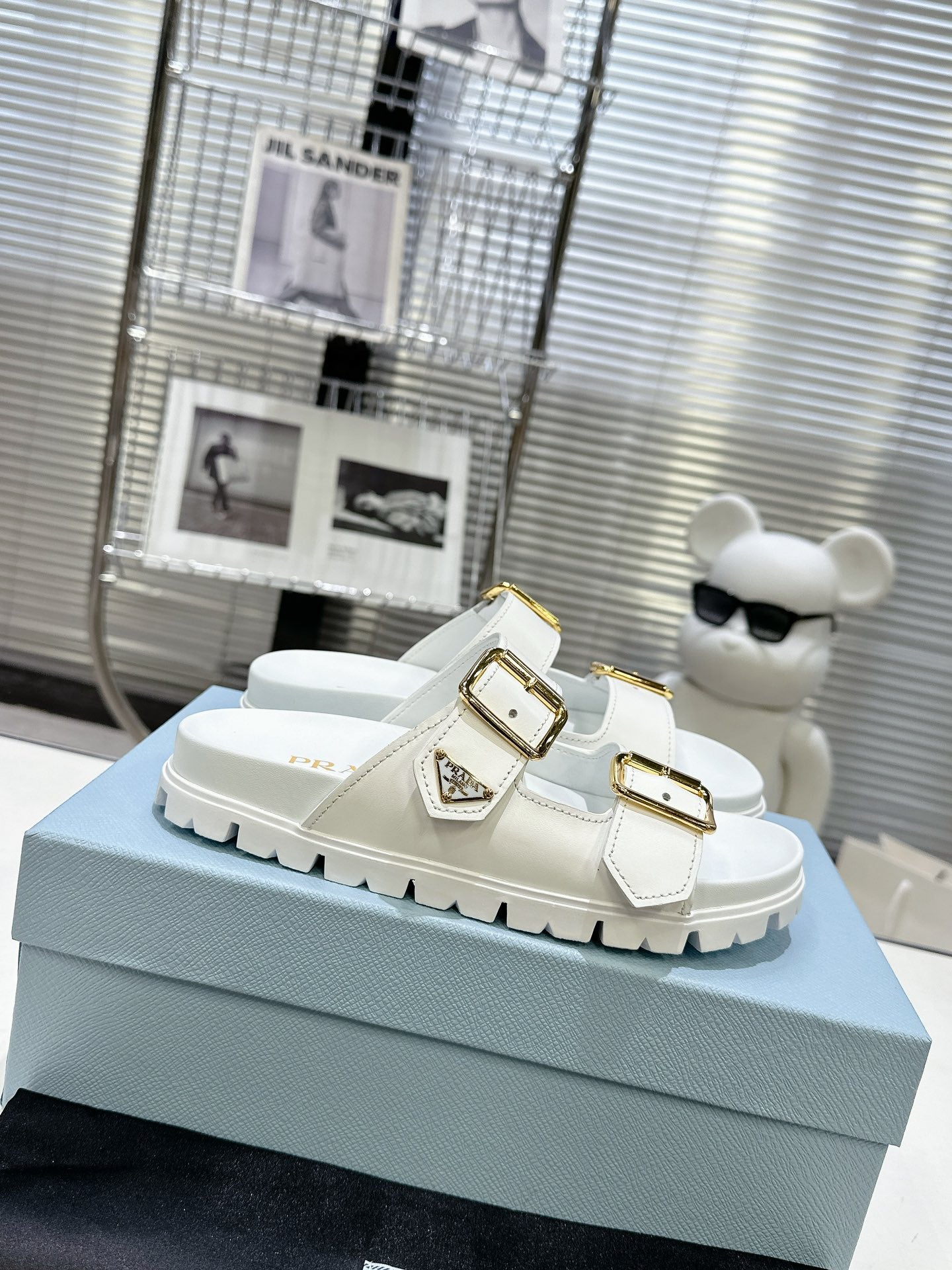 PRADA 25S STRAP SLIDES 30MM IN WHITE CALFSKIN GOLD HARDWARE