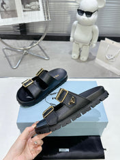PRADA 25S STRAP SLIDES 30MM IN BLACK CALFSKIN GOLD HARDWARE