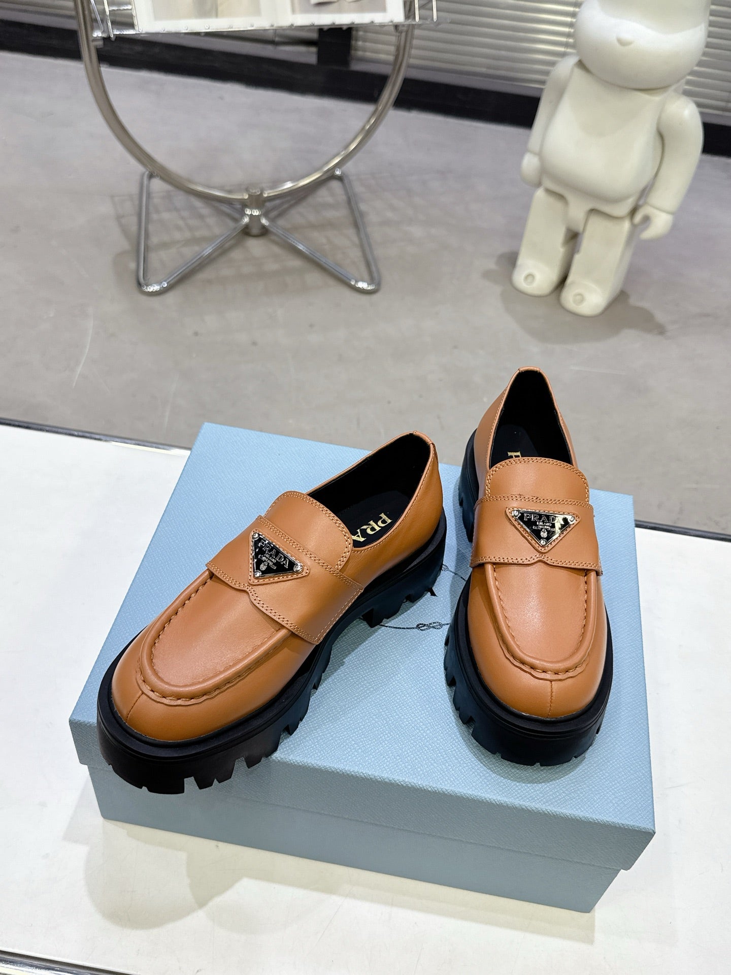 PRADA 25S THICK-SOLE LOAFERS 60 MM IN COGNAC BROWN CALFSKIN