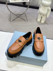 PRADA 25S THICK-SOLE LOAFERS 60 MM IN COGNAC BROWN CALFSKIN
