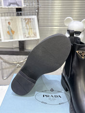 PRADA 25S RETRO PLATFORM MARTIN BOOTS IN BLACK CALFSKIN