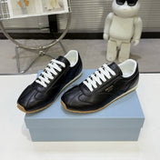 PRADA 26S LACE UP SNEAKERS IN BLACK CALFSKIN