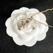 CHANEL 26S DOUBLE C LOGO CLEAR BOW PENDANT NECKLACE IN GOLD METAL 629174