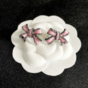 CHANEL 26S PINK ENAMEL BOW CRYSTAL STUD EARRINGS IN BLACK METAL 629977