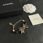 CHANEL 26S CRYSTAL BOW PEARL & BEAD CHAIN BRACELET IN GOLD METAL 629979