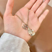 CHANEL 26S DOUBLE C LOGO SAILBOAT PENDANT NECKLACE WITH PEARL IN GOLD METAL 630060