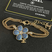 CHANEL 26S DOUBLE C LOGO BLUE ENAMEL FLOWER CHAIN BRACELET WITH CRYSTAL DETAIL IN GOLD METAL 633154