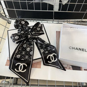 CHANEL 26S HAIR SCRUNCHIE IN BLACK SILK 503074