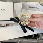 CHANEL 26S PEARL HAIR ELASTIC IN WHITE AND BLACK RIBBON 505297