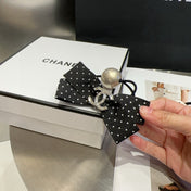 CHANEL 26S BOW HAIR TIE IN BLACK WITH WHITE POLKA DOTS 505302