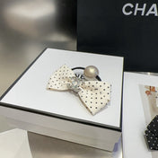 CHANEL 26S BOW HAIR TIE IN BLACK WITH WHITE POLKA DOTS 505301