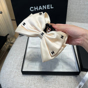 CHANEL 26S BOW HAIR CLIP IN WHITE RIBBON 512127