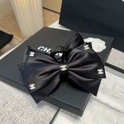 CHANEL 26S BOW HAIR CLIP IN BLACK RIBBON 512128
