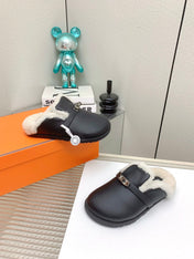 SLIP-ON MULE IN BLACK CALFSKIN AND SHEARLING LINING