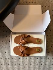 YSL 26S TWISTED-STRAP FLAT SANDALS IN  BROWN LAMBSKIN