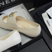 CHANEL 26S MARY JANE FLATS IN WHITE AND BLACK CALFSKIN WITH GOLD TONE CC LOGO