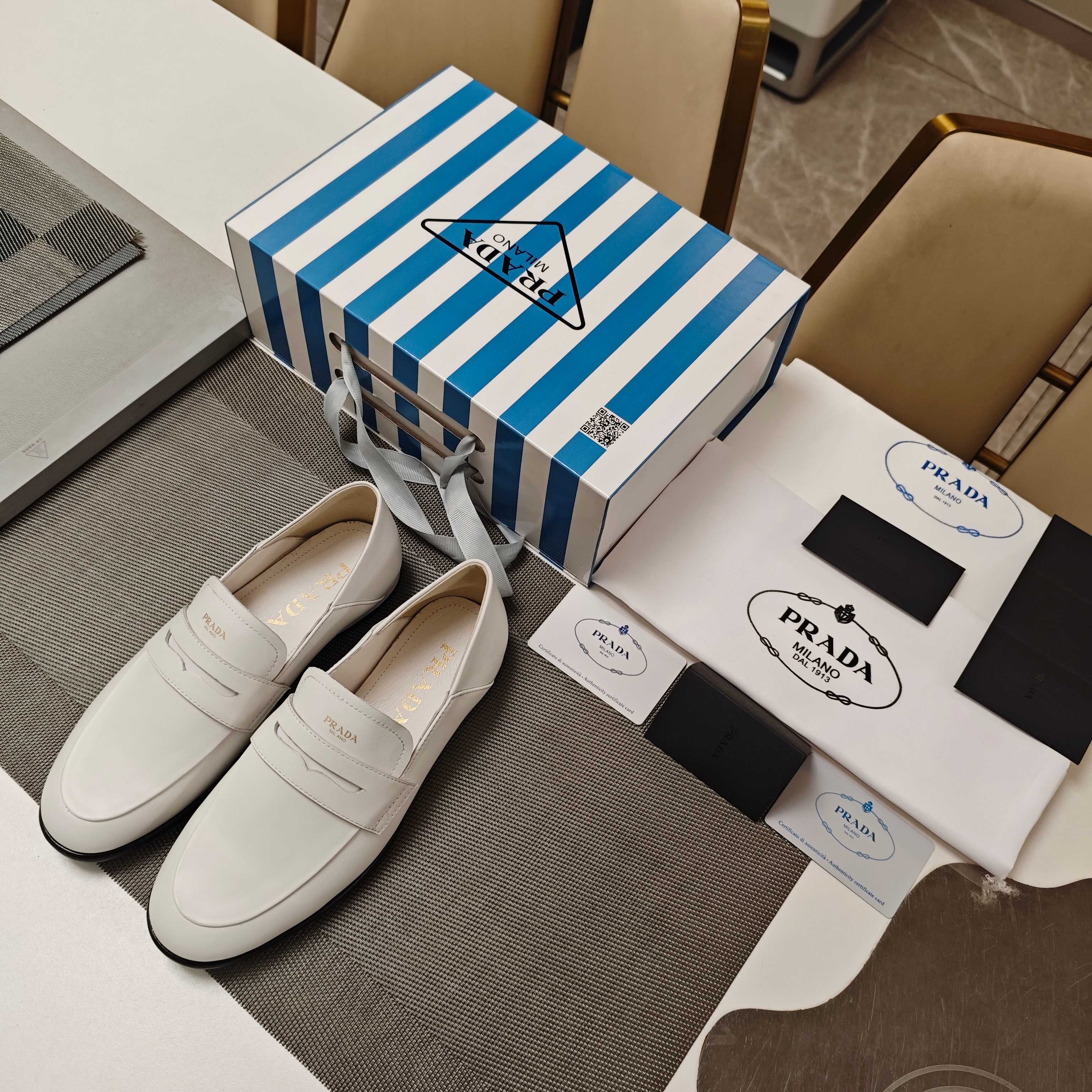 PRADA 26S LOAFERS 20MM IN CREAM WHITE CALFSKIN