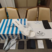 PRADA 26S HEEL MULE SANDALS 75MM IN WHITE CALFSKIN WITH BOW