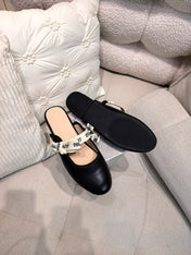 DIOR 26S FLAT MULES IN BLACK CALFSKIN WITH J'ADIOR BOW