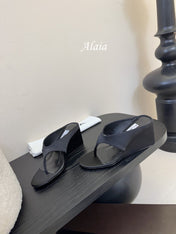 ALAIA WEDGE THONG SANDALS 25S IN BLACK SATIN