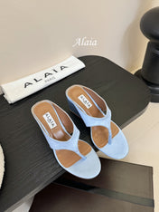 ALAIA WEDGE THONG SANDALS 25S IN BLUE SATIN