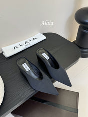 ALAIA HIGH MULES 25S IN BLACK SATIN