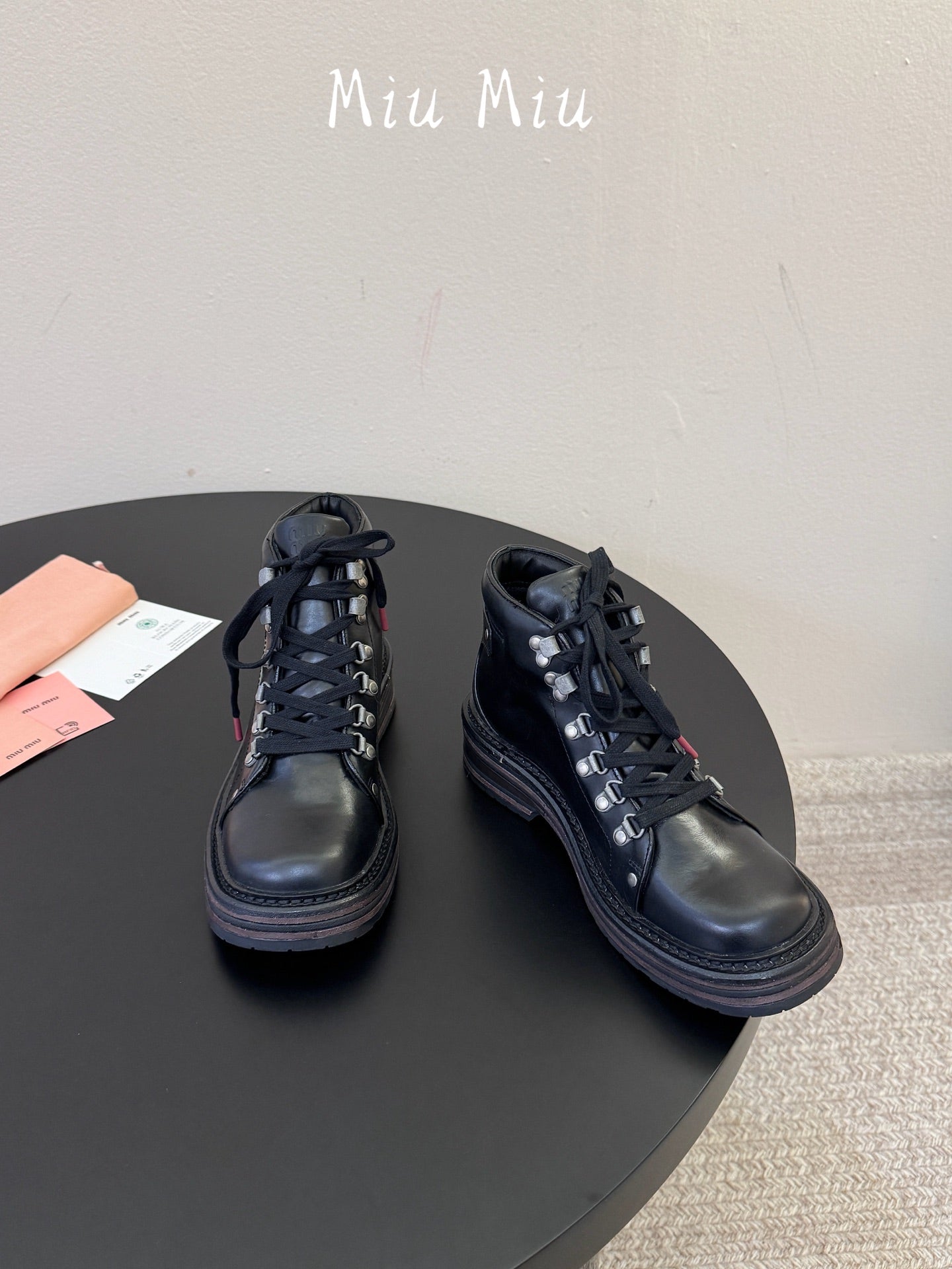 MIUMIU 26S ANKLE MOUNTAIN BOOTS IN BLACK CALFSKIN