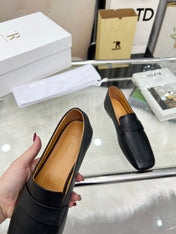 THE ROW 26S PENNY LOAFER FLATS IN BLACK GRAINED CALFSKIN