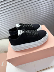 MIUMIU 26S PLATFORM SNEAKERS IN BLACK CANVAS