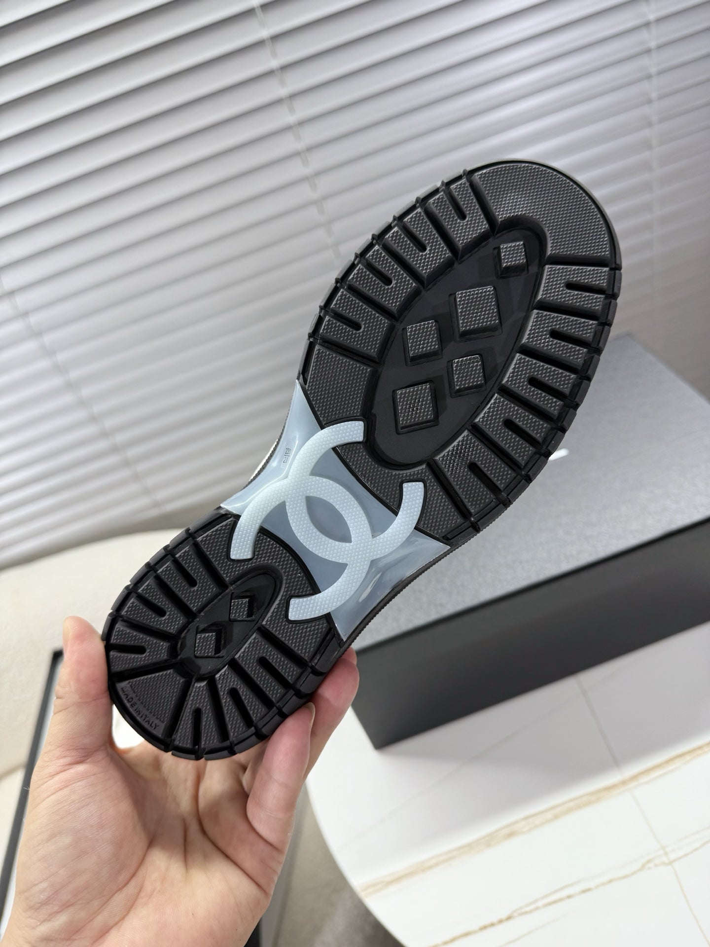CHANEL 25S SNEAKERS WITH FUR ACCENTS 35MM IN BLACK CALFSKIN