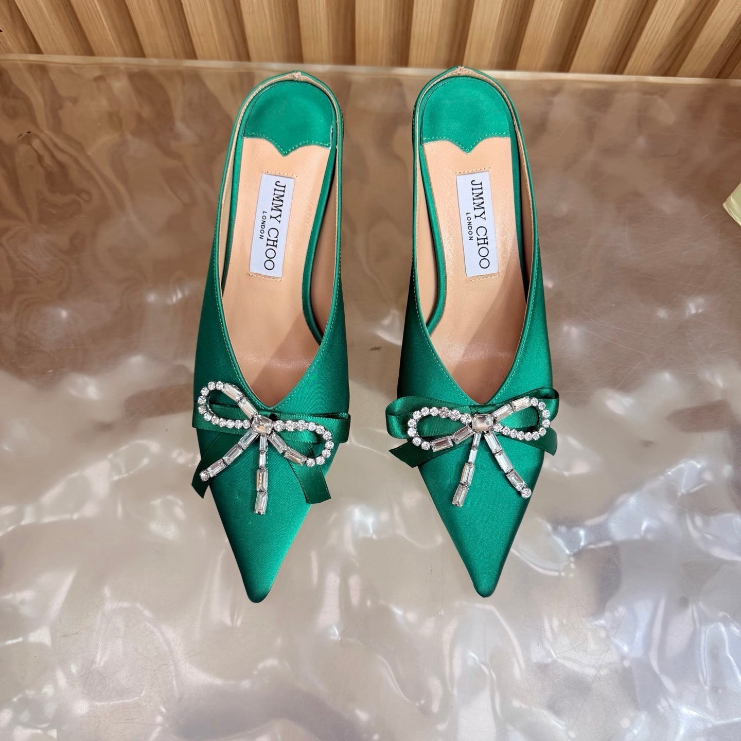 JIMMY CHOO 26S HIGH-HEELED MULES 65 MM IN GREEN SATIN WITH RHINESTONE BOW