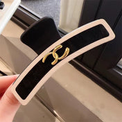 CHANEL 26S BARRETTE HAIR CLIP IN BLACK AND IVORY LEATHER 505338