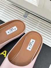 ALAIA FLAT MULE IN LIGHT PINK LAMBSKIN
