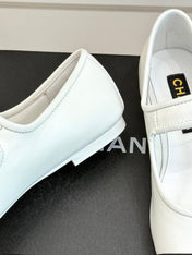 FLAT SHOES IN BLACK AND WHITE LAMBSKIN GOLD HARDWARE