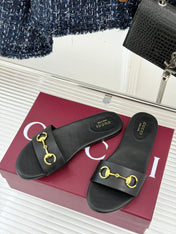 SLIDE SANDALS IN BLACK CALFSKIN WITH GOLD HARDWARE