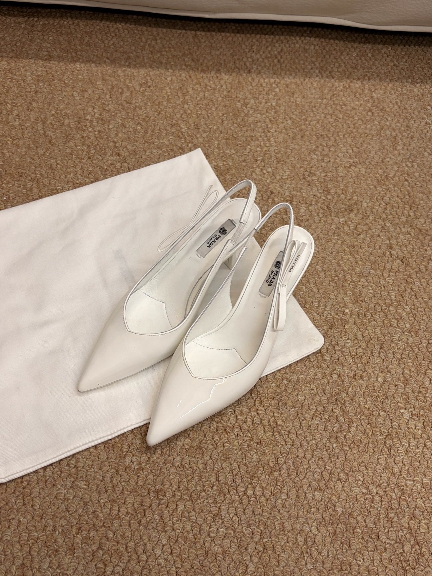 PRADA 26S SLINGBACK PUMPS IN WHITE PATENT CALFSKIN