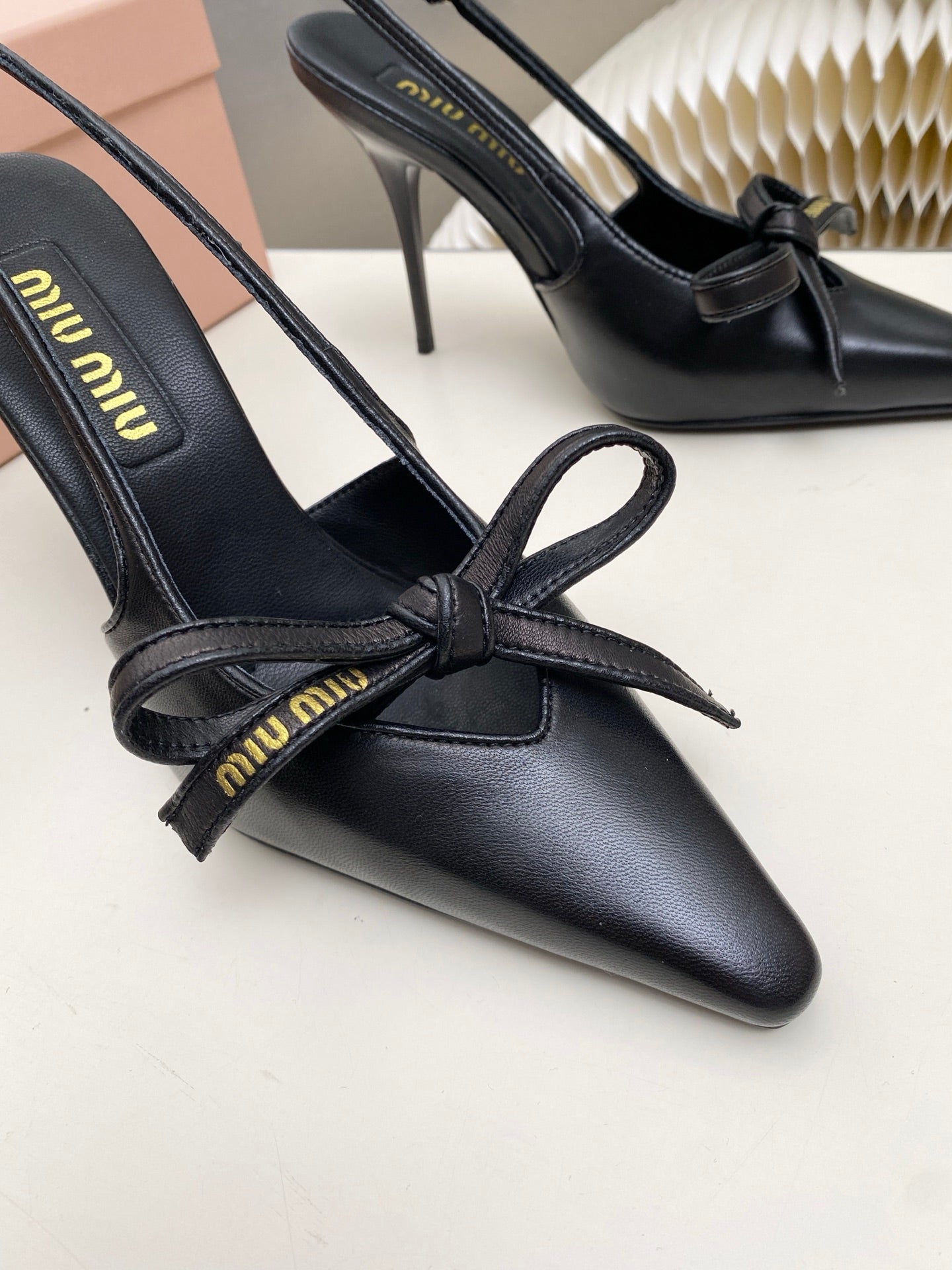 MIUMIU 26S SLINGBACK PUMPS 105MM IN BLACK CALFSKIN WITH BOW