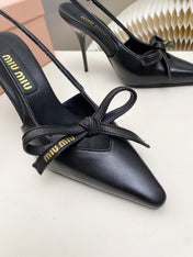 MIUMIU 26S SLINGBACK PUMPS 105MM IN BLACK CALFSKIN WITH BOW