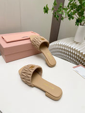 MIUMIU 26S MATELASSE SLIDES IN BEIGE CALFSKIN