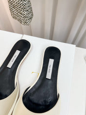 THE ROW 26S PIXEL APPLIQUE MULES IN IVORY WHITE CALFSKIN