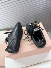 MIUMIU 26S GYMNASIUM SNEAKER IN BLACK CALFSKIN WITH GOLD BUCKLED STRAP