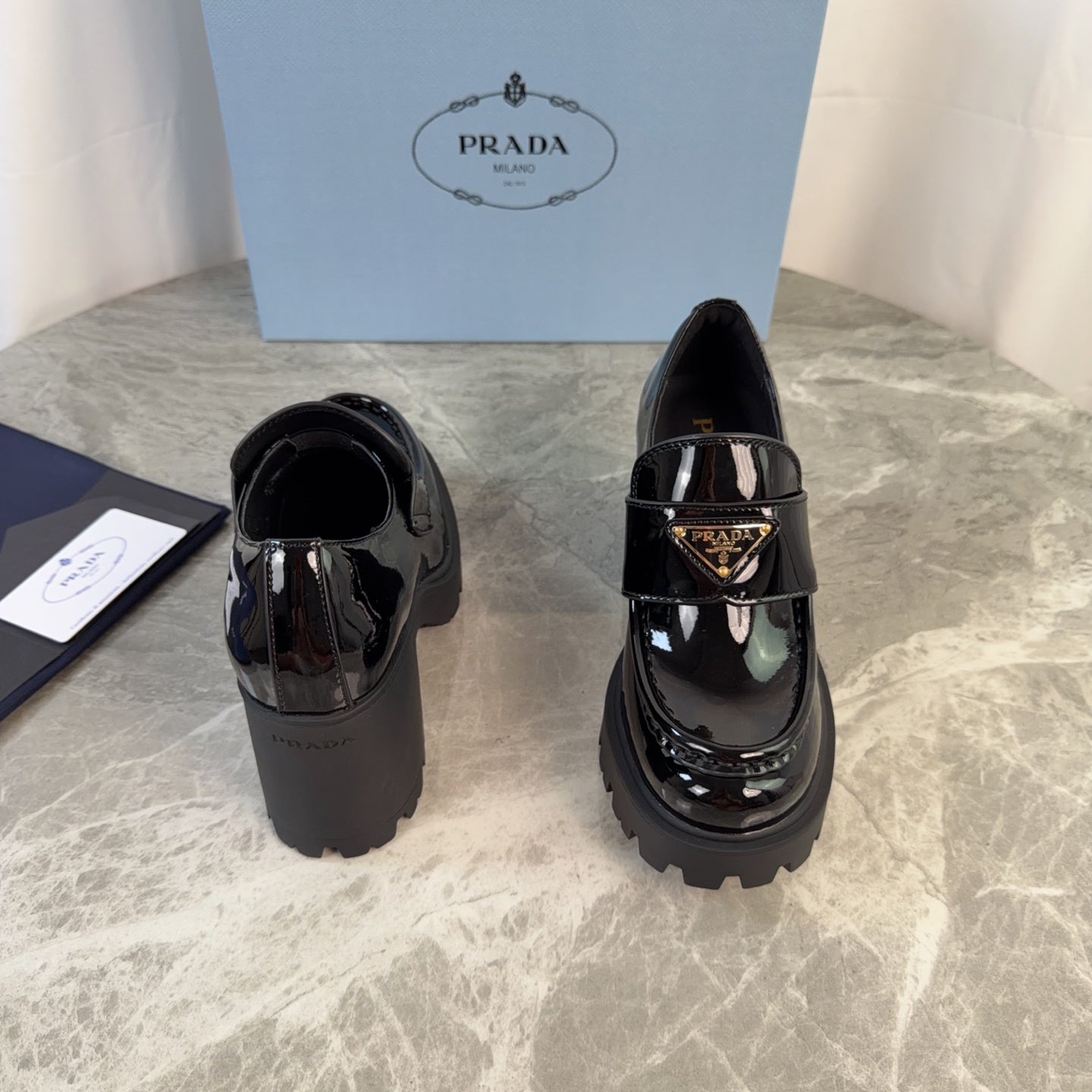 PRADA 26S HEELED LOAFERS 85 MM IN BLACK PATENT CALFSKIN