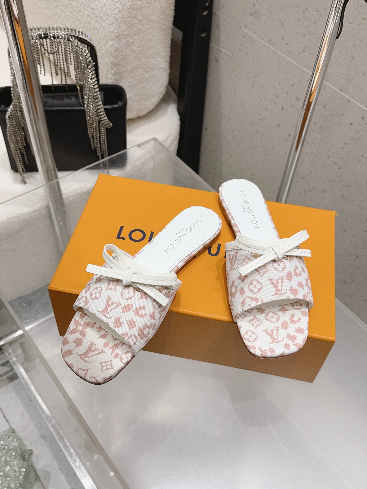 LV 26S FLAT MULE SANDALS IN WHITE PINK MONOGRAM CANVAS WITH CALFSKIN BOW
