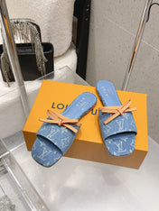 LV 26S FLAT MULE SANDALS IN LIGHT BLUE MONOGRAM DENIM WITH CALFSKIN BOW