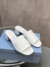 PRADA 26S BLOCK HEEL SLIDE SANDALS 60MM IN WHITE CALFSKIN WITH LOGO