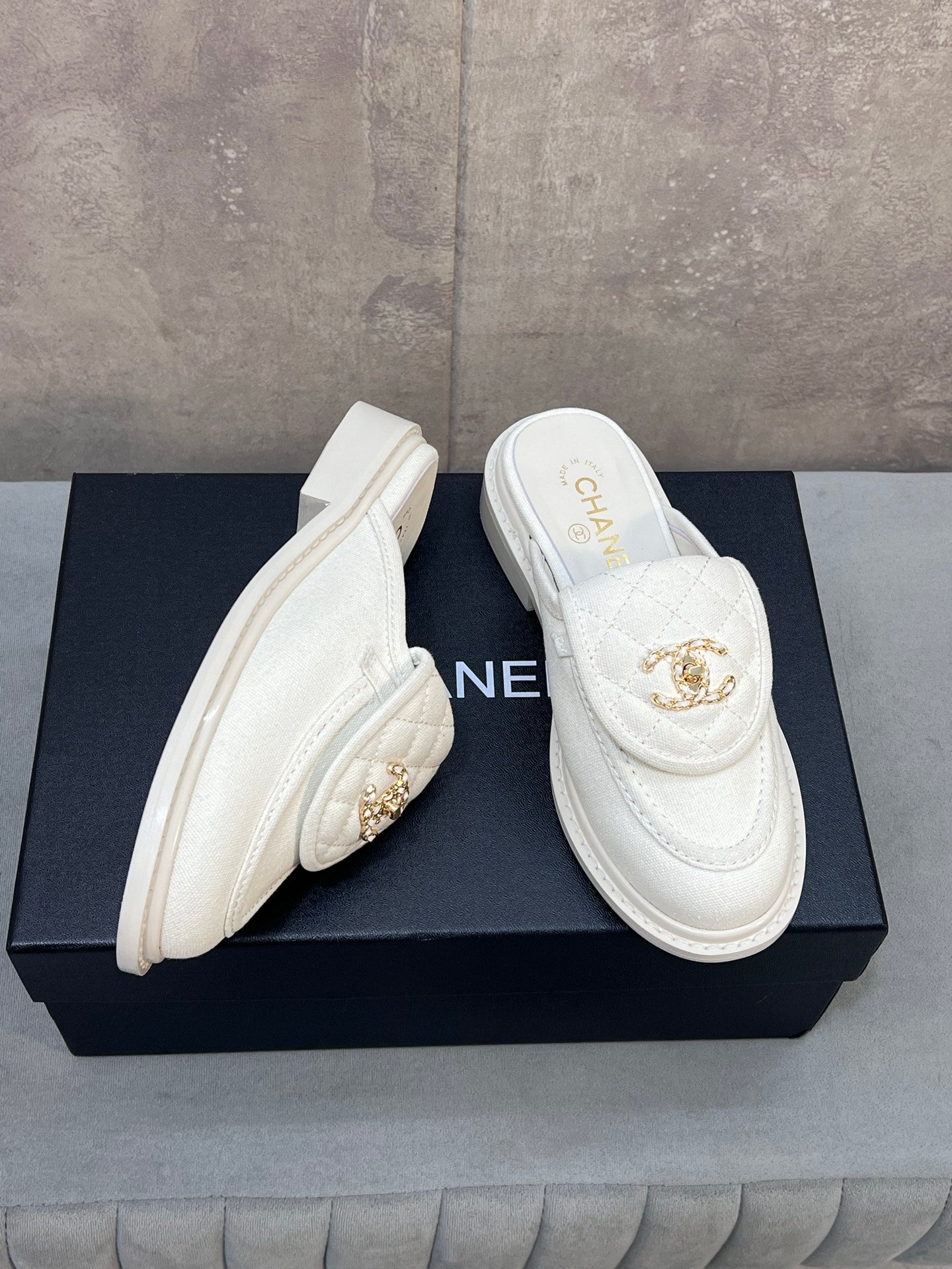 CHANEL 26S MULE LOAFERS IN WHITE CANVAS WITH QUILTED FLAP & CC LOGO